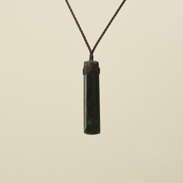 Kawakawa Toki Medium Pounamu Pendant Brown Binding