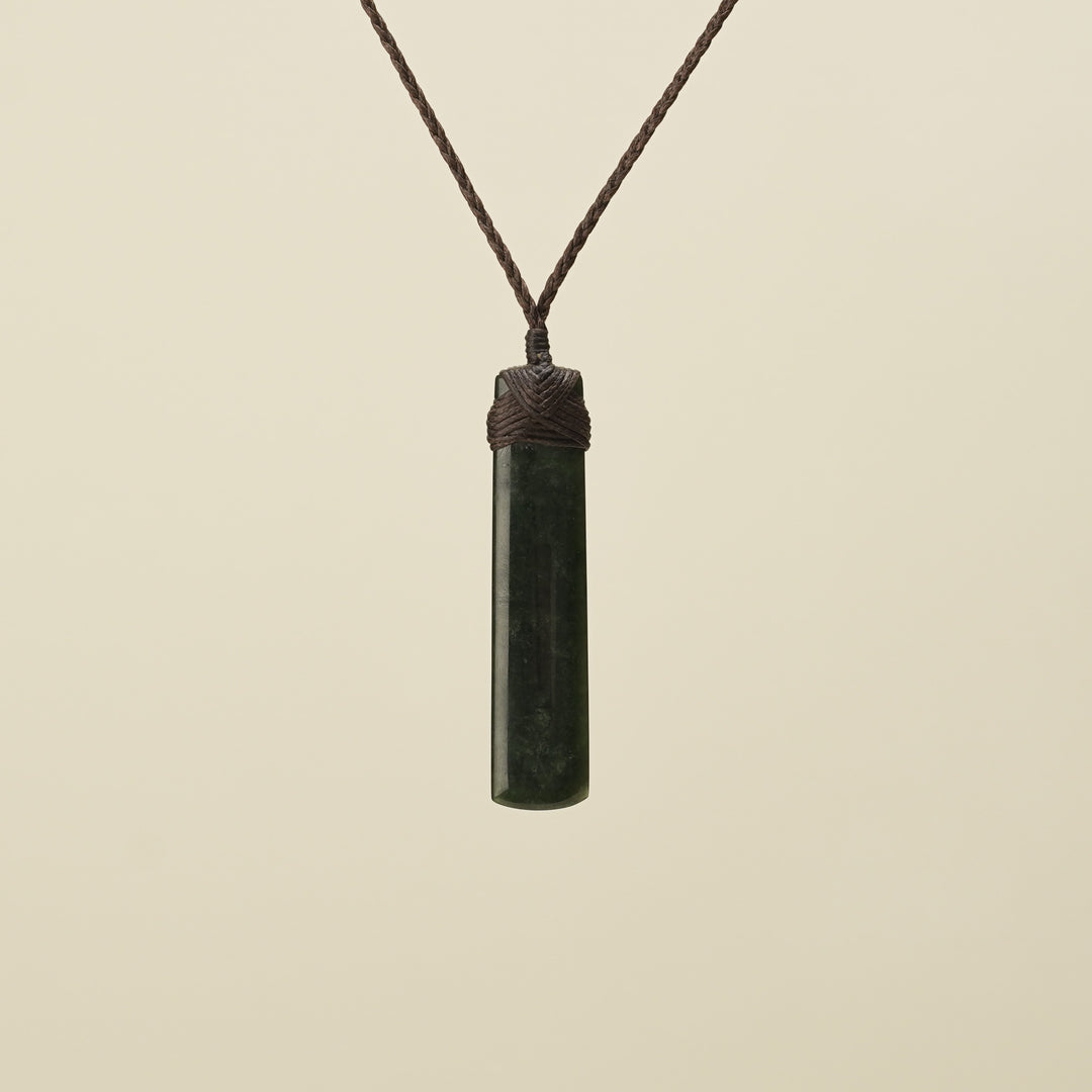 Kawakawa Toki Medium Pounamu Pendant Brown Binding