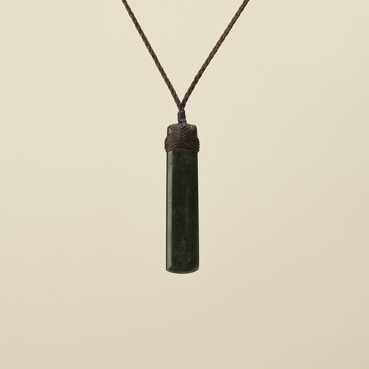 Kawakawa Toki Medium Pounamu Pendant Brown Binding