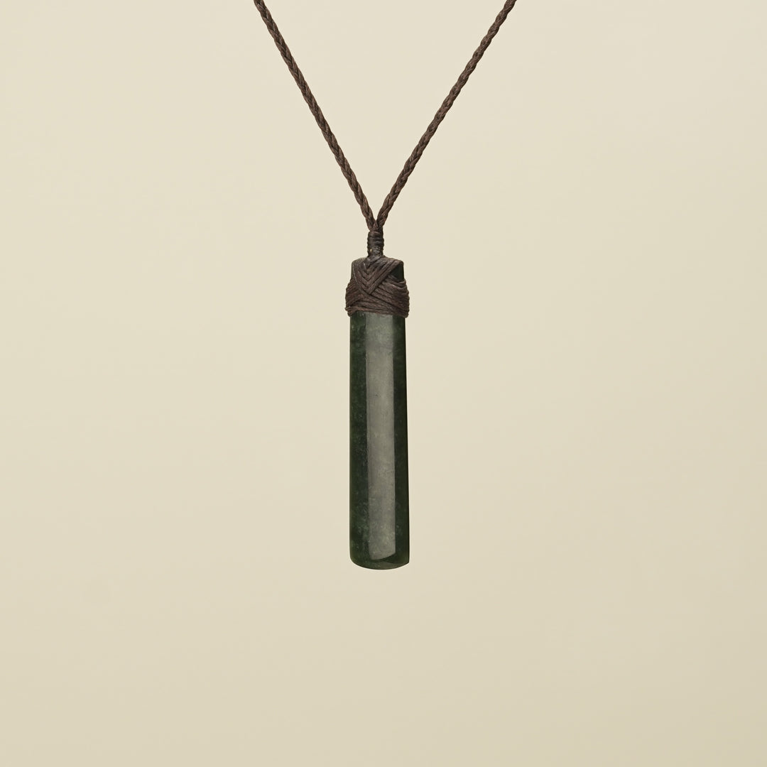 Kawakawa Toki Medium Pounamu Pendant Brown Binding