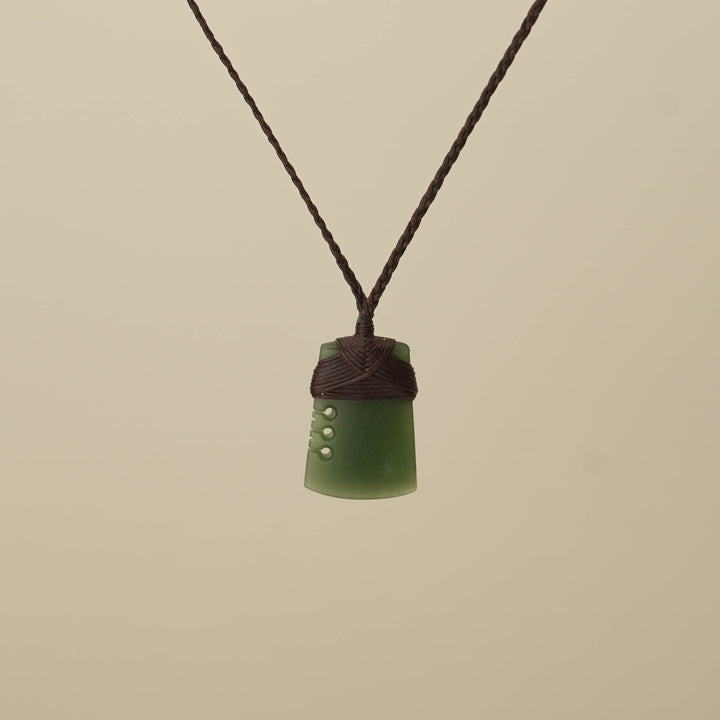Notched Kawakawa Small Toki Pounamu Pendant, Brown Binding