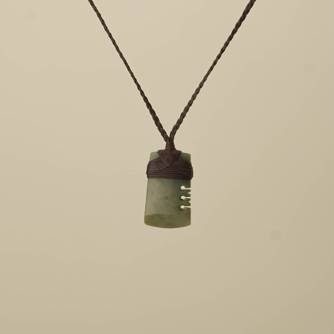 Notched Raukaraka Small Toki Pounamu Pendant, Brown Binding