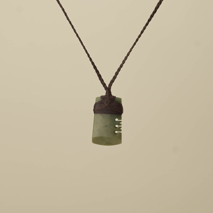 Notched Raukaraka Small Toki Pounamu Pendant, Brown Binding