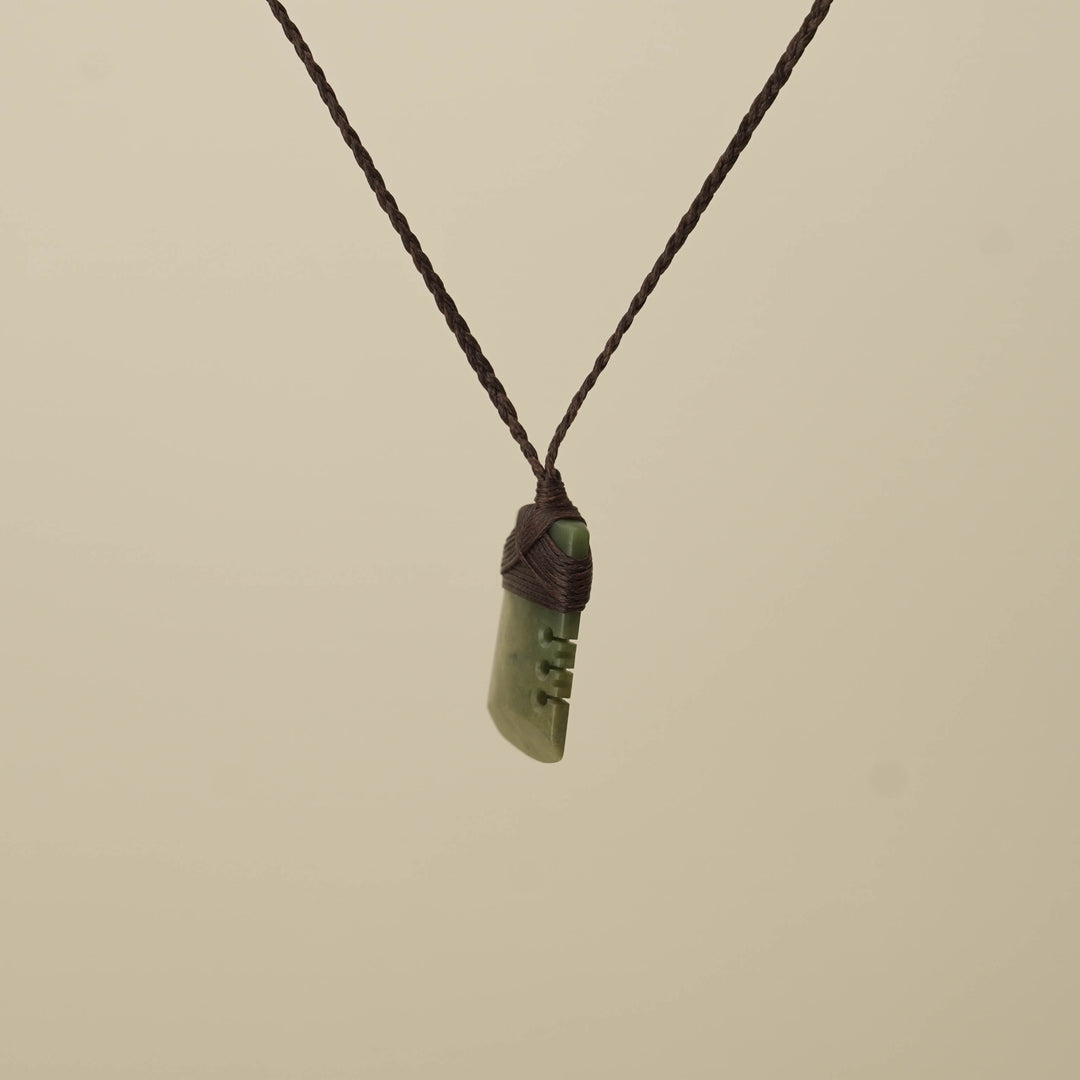 Notched Raukaraka Small Toki Pounamu Pendant, Brown Binding