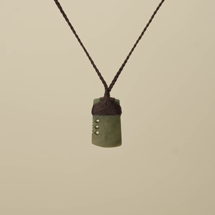 Notched Raukaraka Small Toki Pounamu Pendant, Brown Binding