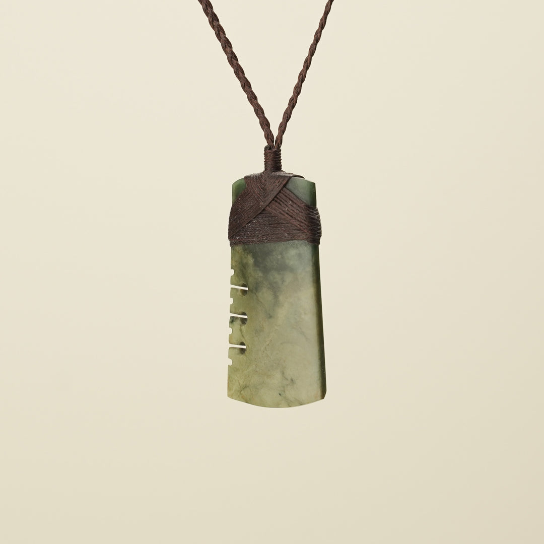 Notched Toki Raukaraka Medium Pounamu Pendant, Brown Binding