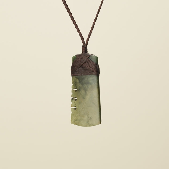 Notched Toki Raukaraka Medium Pounamu Pendant, Brown Binding