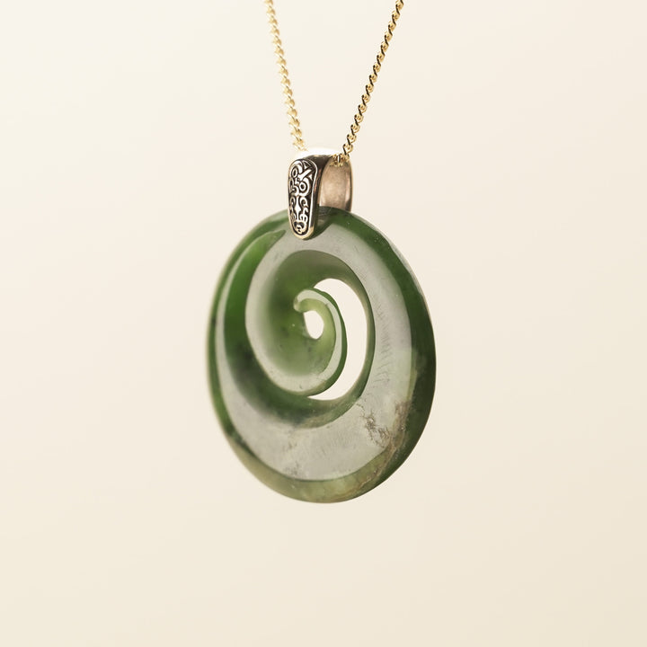 Flower Pounamu Porowhita Koru Pendant with Tiki Bail