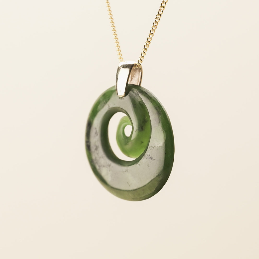 Flower Pounamu Porowhita Koru Pendant with Tiki Bail