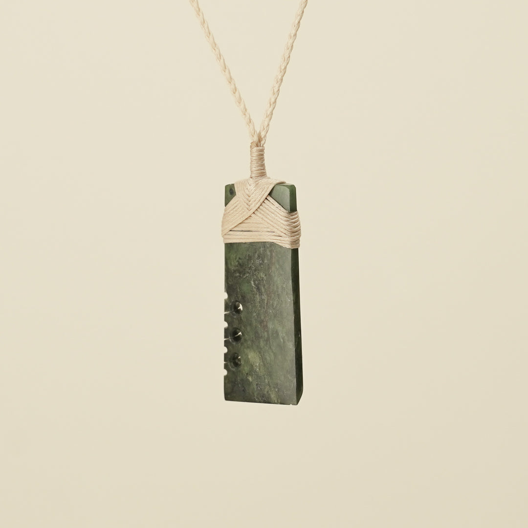 Notched Toki Hapopo Medium Pounamu Pendant Tan Binding