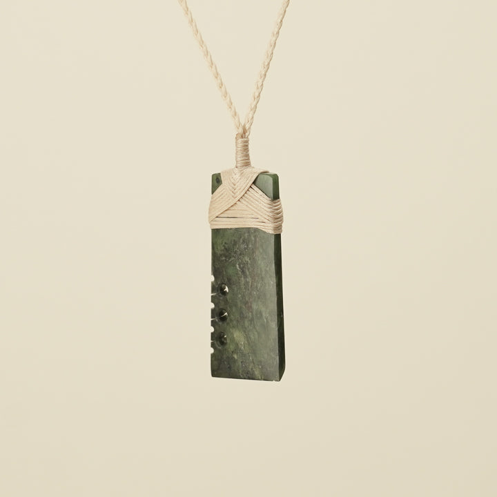 Notched Toki Hapopo Medium Pounamu Pendant Tan Binding