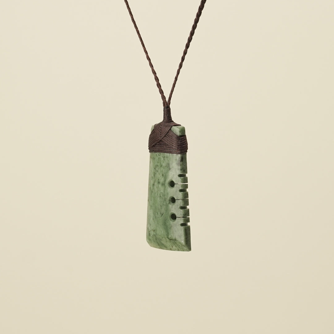 Notched Toki Inanga Medium Large Pounamu Pendant Brown Binding