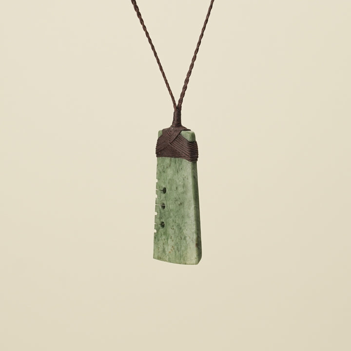 Notched Toki Inanga Medium Large Pounamu Pendant Brown Binding