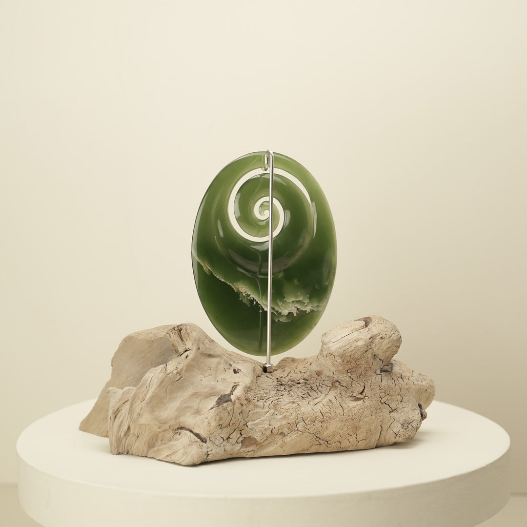 Koru Pounamu Sculpture on Wood Base