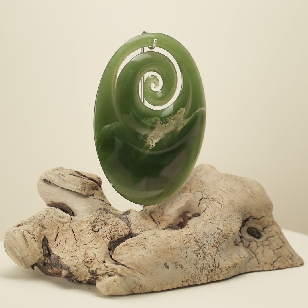Koru Pounamu Sculpture on Wood Base