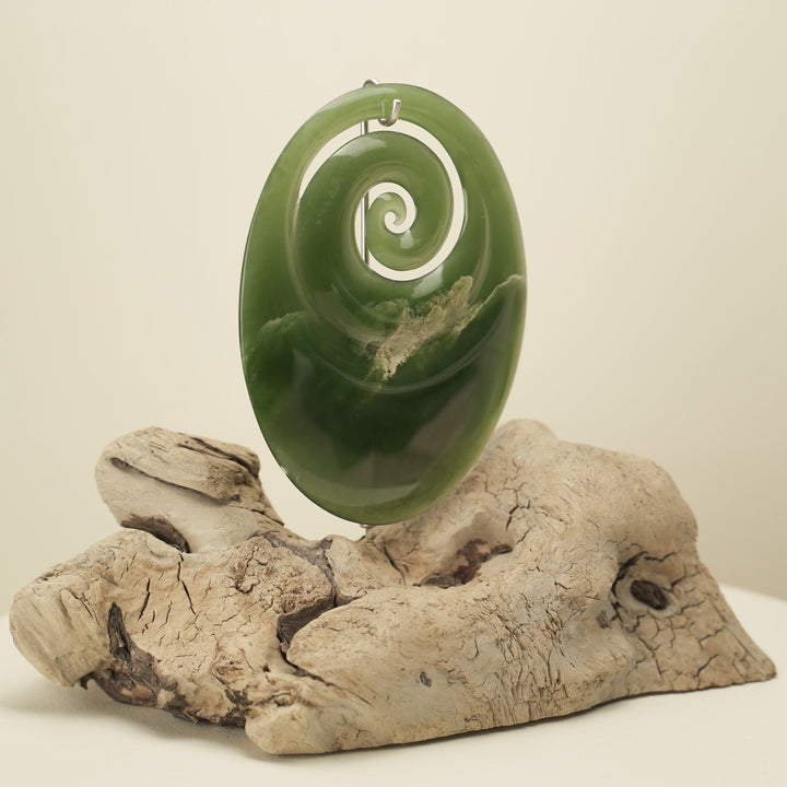 Koru Pounamu Sculpture on Wood Base