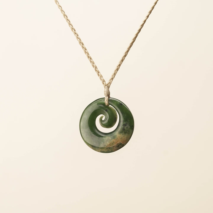 Flower Pounamu Medium Koru Pendant, Tan Binding
