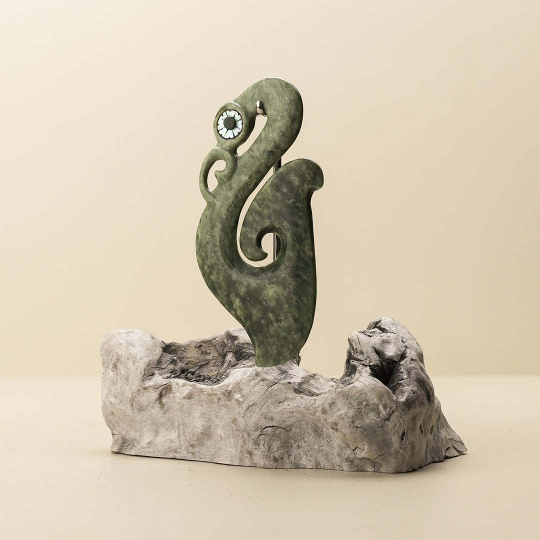 Manaia Kawakawa Pounamu Sculpture with Pāua Eye on Driftwood
