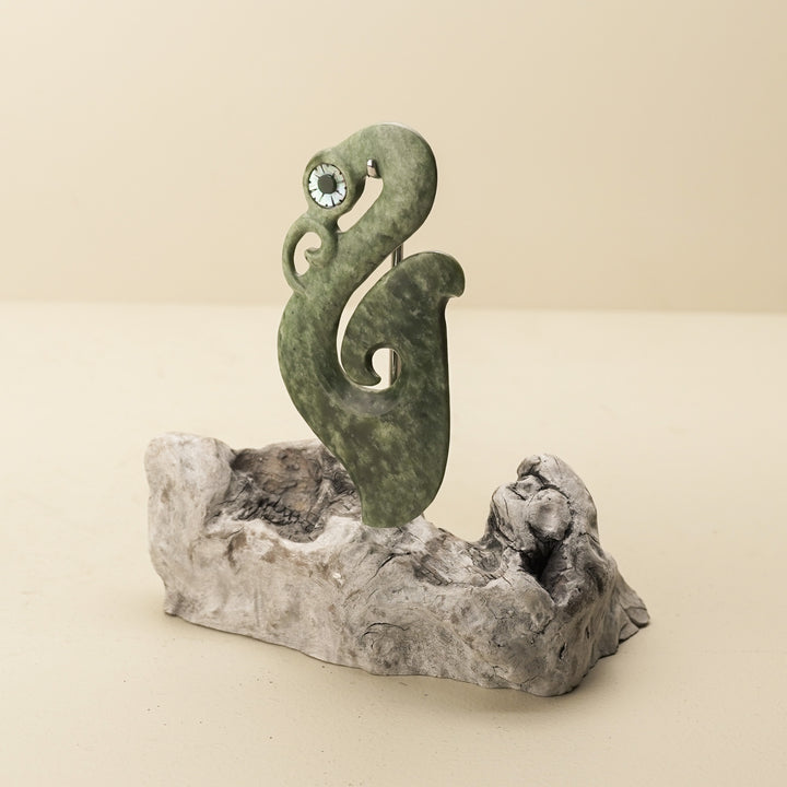 Manaia Kawakawa Pounamu Sculpture with Pāua Eye on Driftwood