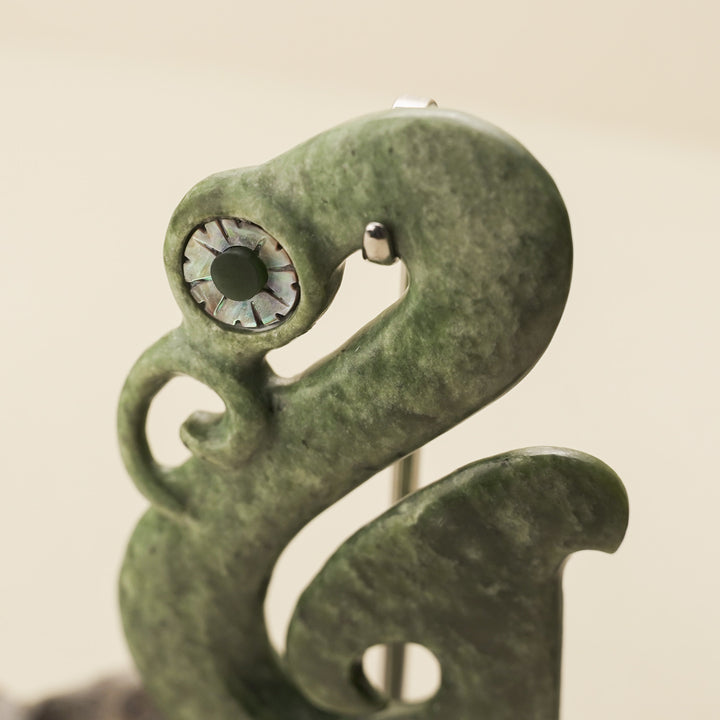 Manaia Kawakawa Pounamu Sculpture with Pāua Eye on Driftwood