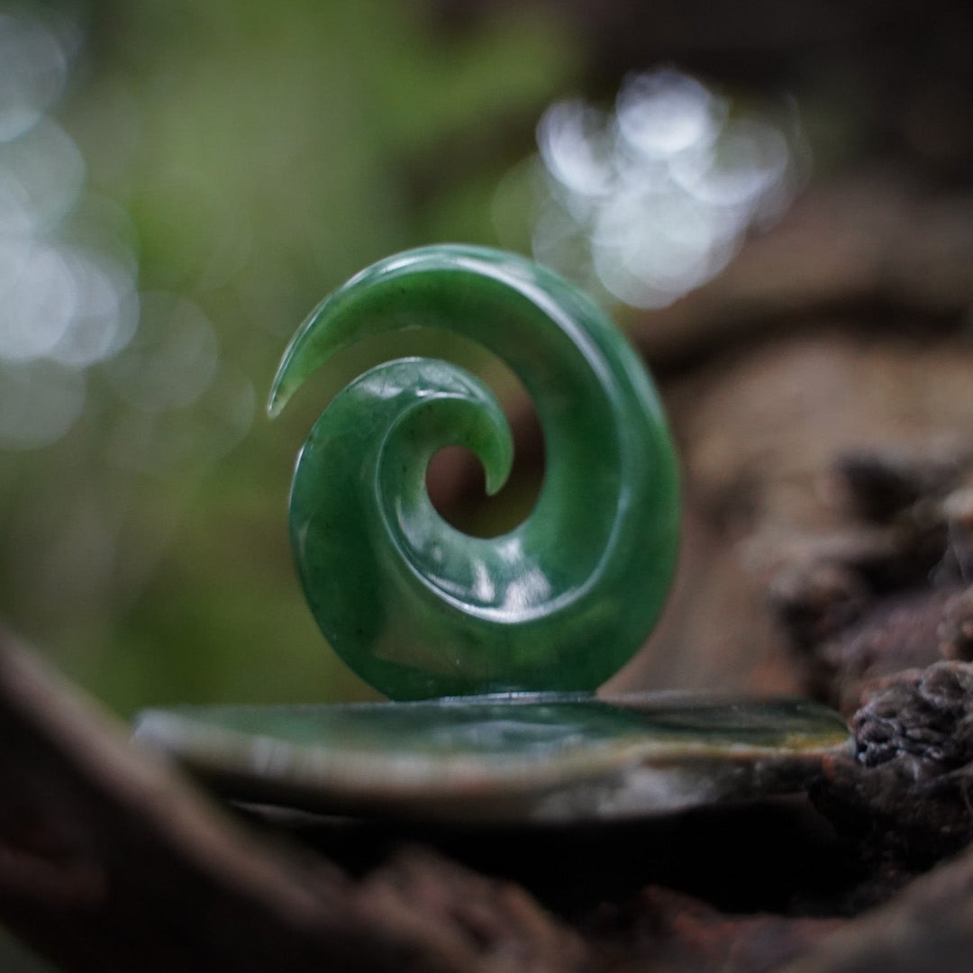Large koru on greenstone base